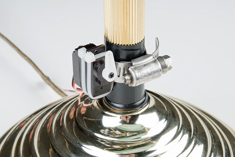 Using a screw, attach a servo arm to the servo’s shaft